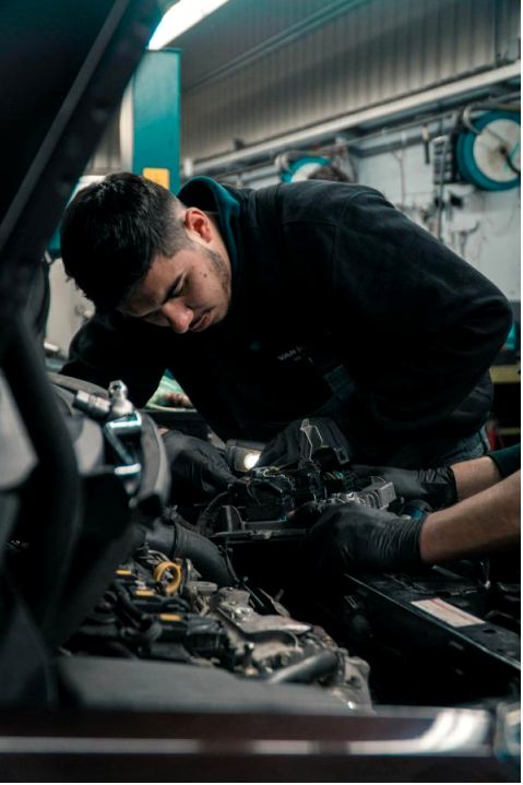 Technician inspecting brakes